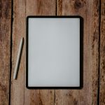 white and black board on brown wooden surface